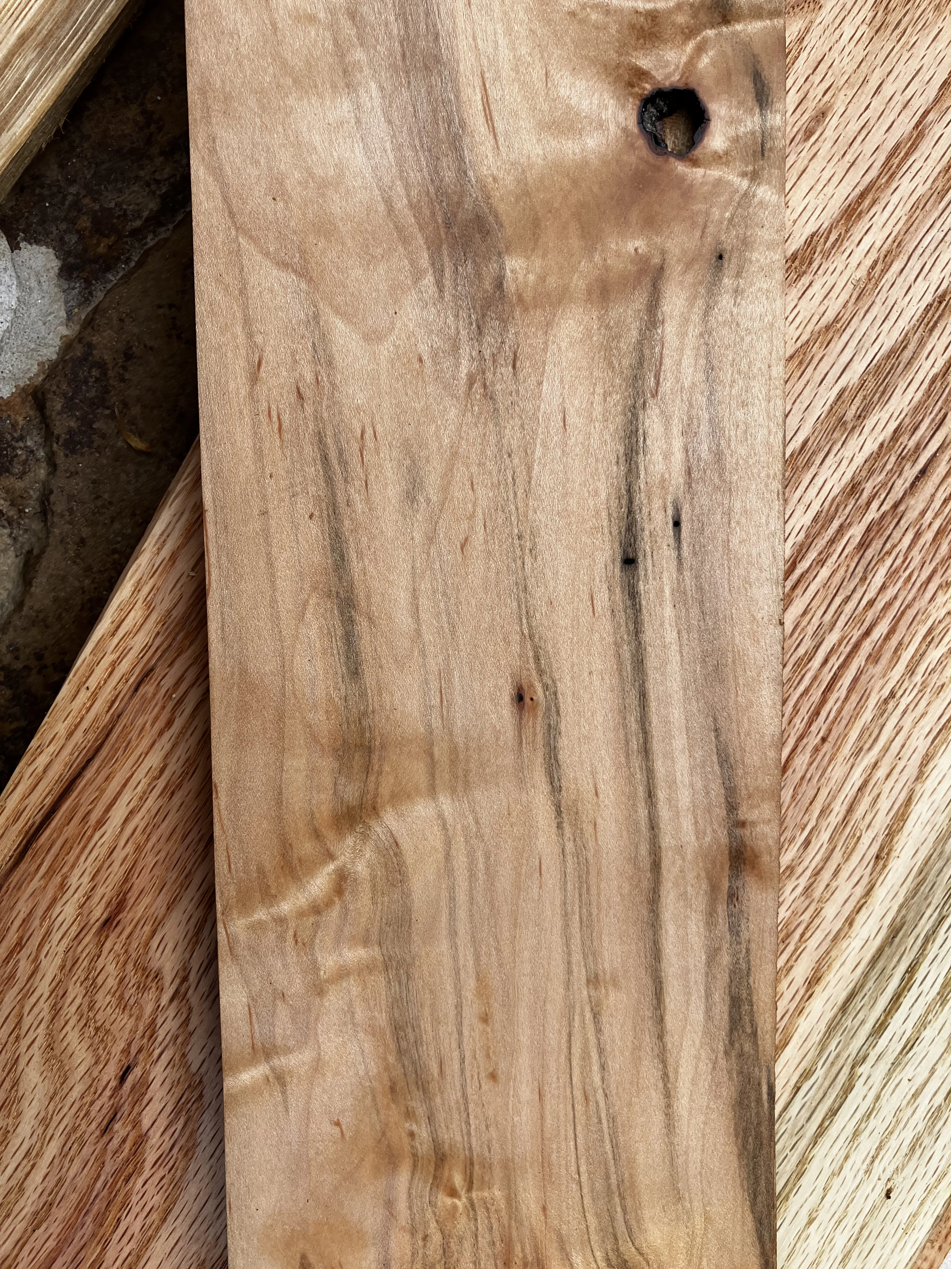 Maple wood grain — pale creamy tones with a fine, uniform grain pattern, harvested in Tennessee