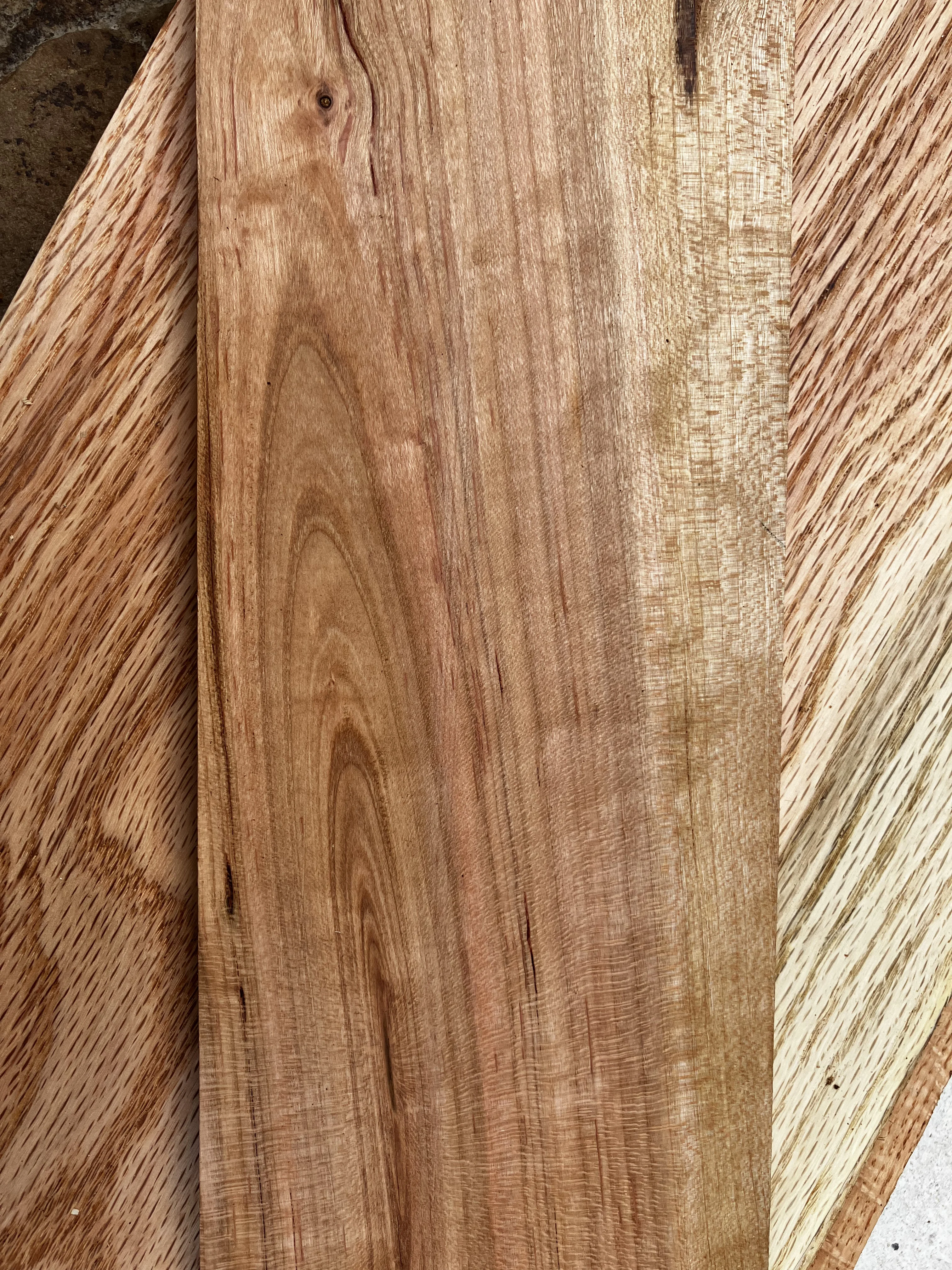 Cherry wood grain — warm reddish-amber tones that deepen and enrich with age, harvested in Tennessee