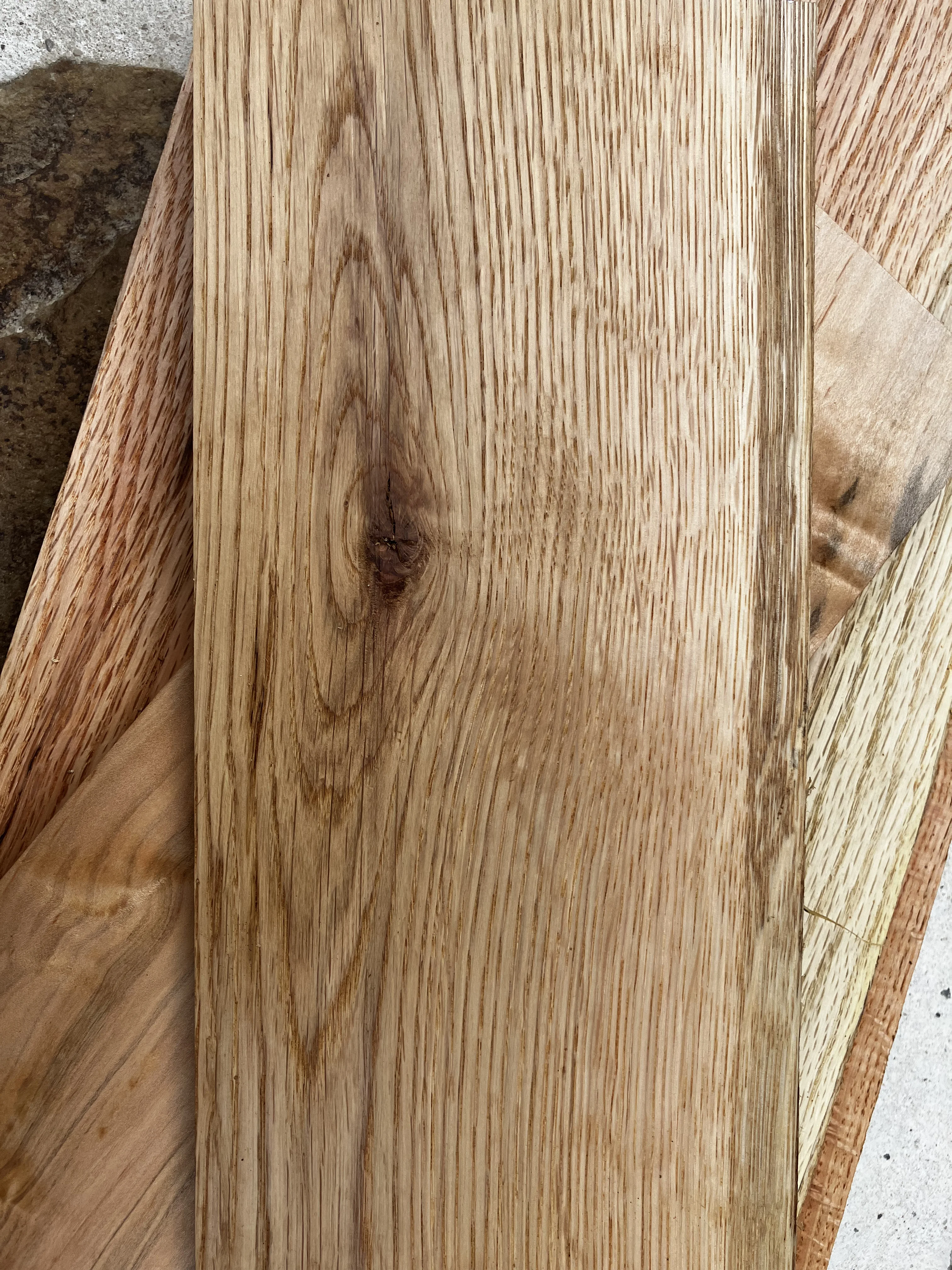 White oak wood grain — light golden tones with a straight, open grain pattern, harvested in Tennessee